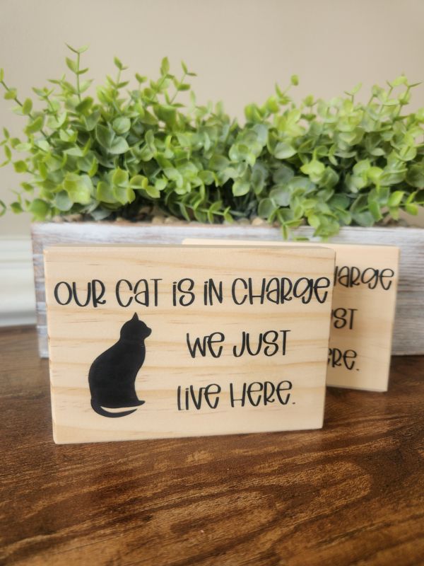 Our Cat Is In Charge Sign