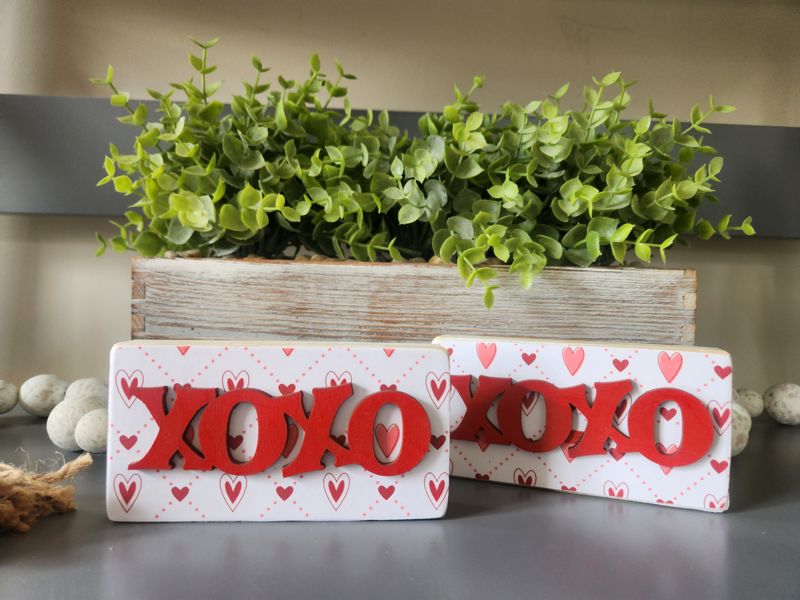 XOXO with Heart Pattern Background